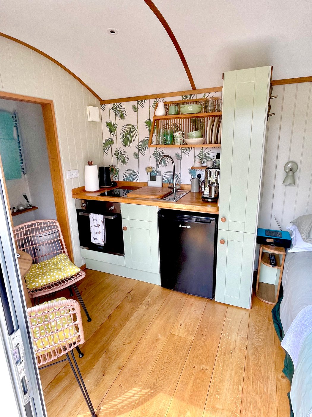 Interior shot of the Shepherds Hut, egg shell rustic decor with oak finish